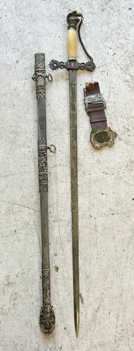 Fraternal sword with sheath and partial belt hardware, just as we found it in local estate, nice: Fraternal sword with sheath and partial belt hardware, just as we found it in local estate, nice overall condition, sword measures 35.5" long.