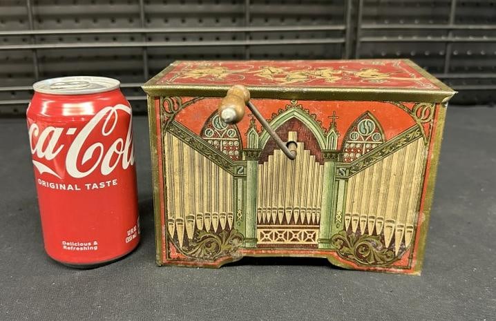 Tin litho windup music box, working condition, from local estate, measures 7.5" x 5" x 5" high.: Tin litho windup music box, working condition, from local estate, measures 7.5" x 5" x 5" high.