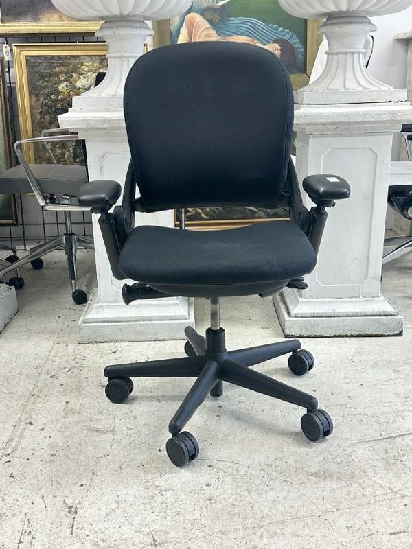 SteelCase Leap chair, black, fabric & pivot arms, in very nice functional condition. From a major: SteelCase Leap chair, black, fabric & pivot arms, in very nice functional condition. From a major Times Square Corporation, who closed their offices….just as we found them, may be a scuff here or th