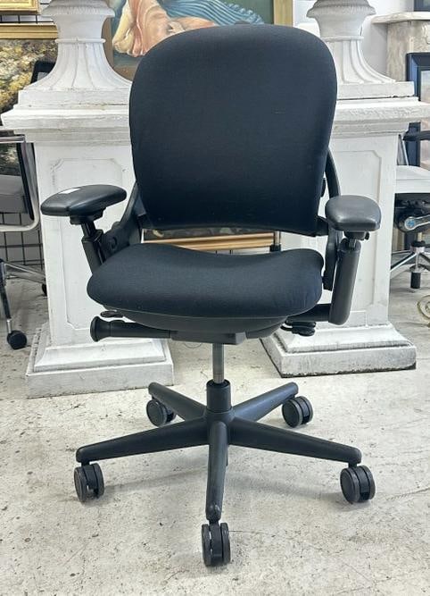 SteelCase Leap chair, black, fabric & pivot arms, in very nice functional condition. From a major: SteelCase Leap chair, black, fabric & pivot arms, in very nice functional condition. From a major Times Square Corporation, who closed their offices….just as we found them, may be a scuff here or th