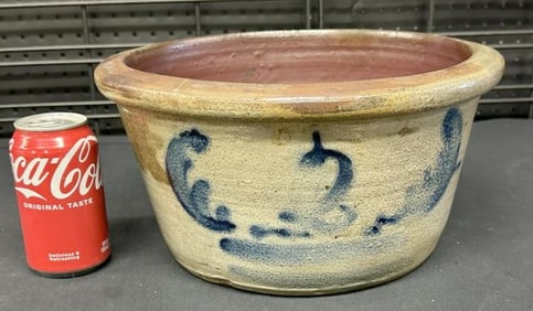 Unusual form decorated stoneware crock ( has hairlines ), measures 6.5" high x 12.5" across the top,
