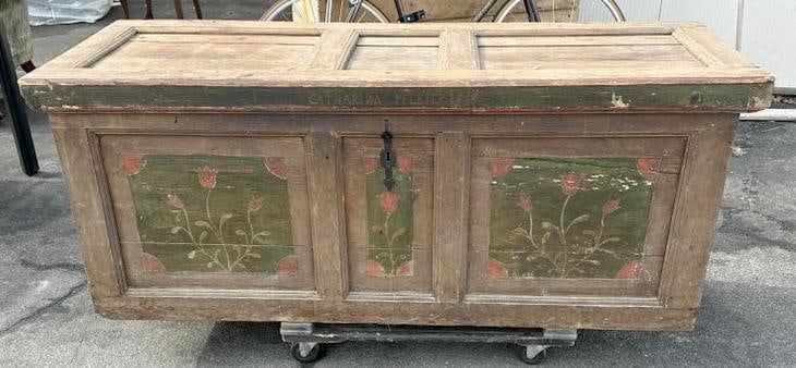 Wonderful Continental oversized painted storage chest, 19th century, wonderful worn patina,: Wonderful Continental oversized painted storage chest, 19th century, wonderful worn patina, structurally sound, painted flowers on panels in front, name of owner and date on front also. Measures 64" w