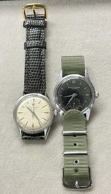 (2) vintage GIRARD PERREGAUX wrist watches, one black dial, one off white, both running after