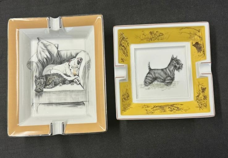 (2) HERMES ashtrays with Scottish Terriers, in fine condition. They measure 8" x 6.5" and 6.25" x: (2) HERMES ashtrays with Scottish Terriers, in fine condition. They measure 8" x 6.5" and 6.25" x 6.25". From the estate of world renowned Scottish Terrier enthusiast, breeder and collector William "B