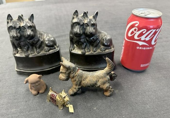 Misc. metal dog lot of figures, including white metal Scotty bookends ( some paint flaking ), small: Misc. metal dog lot of figures, including white metal Scotty bookends ( some paint flaking ), small iron dog with rust, cast iron Scotty with back leg up and small Knowing Solid Perfume small Scotty. 