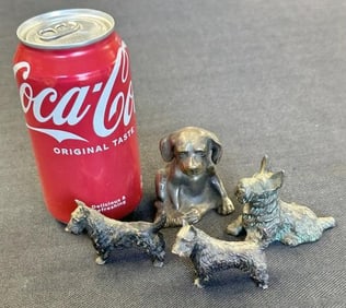 (4) small bronze dog figures, including (3) Scottish Terriers, and (1) other seated, all in nice