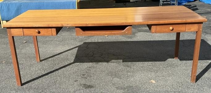 Wonderful cherry custom work table - desk, with drawers and center pullout for laptop. Nice overall: Wonderful cherry custom work table - desk, with drawers and center pullout for laptop. Nice overall condition, with pegged construction. Measures 84" wide x 36.5" deep x 29.5" high.