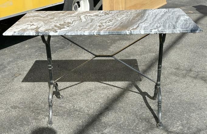Nice marble top table with black iron base, nice form, structurally sound, from nice home in Hudson: Nice marble top table with black iron base, nice form, structurally sound, from nice home in Hudson Valley. Measures 47" wide x 24" deep x 30" high.