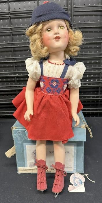 MADAME ALEXANDER "Sonja Henie" doll in original box ( small piece of ice skate blade is off ),: MADAME ALEXANDER "Sonja Henie" doll in original box ( small piece of ice skate blade is off ), original box with some tattering. Some age crackling to face, measures approx. 16" tall, in original clot