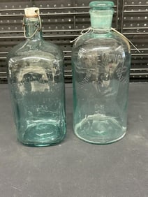 (2) early blue glass water bottles, found in stone house in Hudson Valley, both with stoppers and in