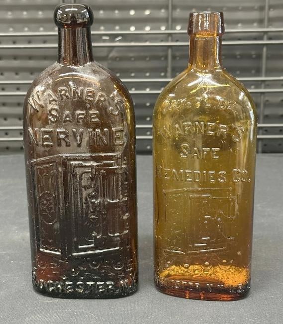 (2) 19th c WARNER'S SAFE NERVINE & WARNER'S SAFE REMEDIES CO. amber color bottles with safe graphics: (2) 19th c WARNER'S SAFE NERVINE & WARNER'S SAFE REMEDIES CO. amber color bottles with safe graphics on fronts, both in nice found estate condition. They measure 9 3/8" high.