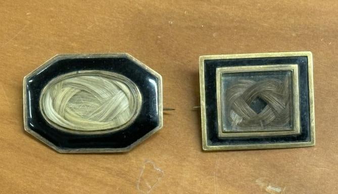 (2) mourning hair brooches, either low carat gold or gold filled, hair intact, cases in nice overall: (2) mourning hair brooches, either low carat gold or gold filled, hair intact, cases in nice overall condition. Found in stone house in Hudson Valley.