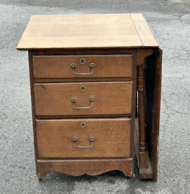 Circa 1900 oak sewing table with extension that pulls up, nice overall finish, structurally sound.