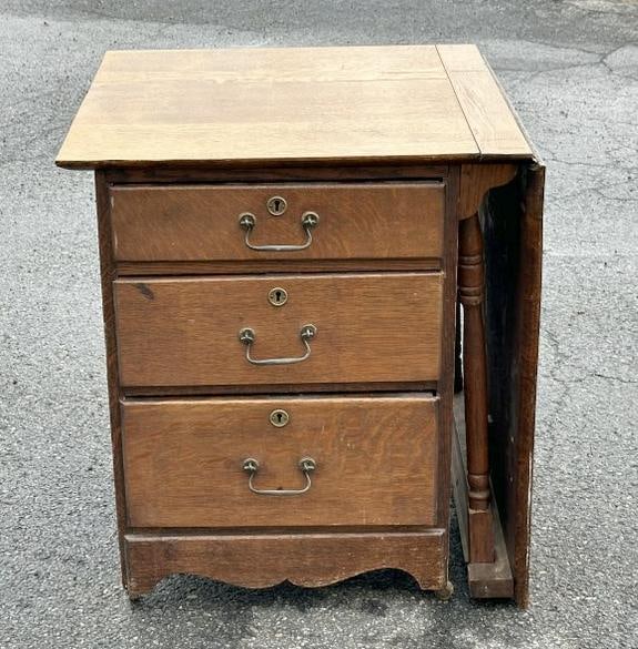 Circa 1900 oak sewing table with extension that pulls up, nice overall finish, structurally sound.: Circa 1900 oak sewing table with extension that pulls up, nice overall finish, structurally sound. Measures 26" high x 22.5" wide x 22.75" deep , opened it measures 47.75" wide.