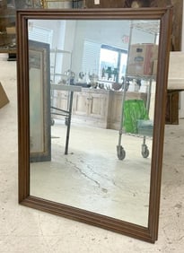 Circa 1970 rectangular mirror, possibly walnut, nice condition, frame measures 44" x 33". From local