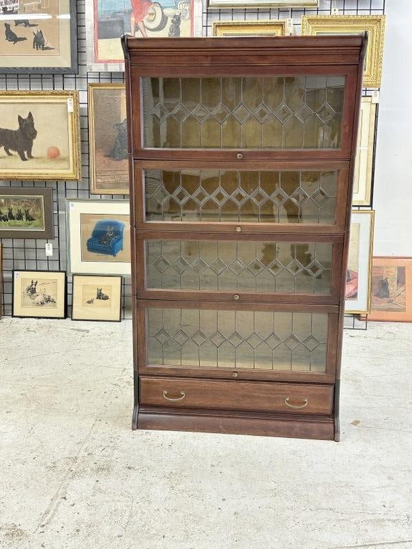 Circa 1910 leaded glass barrister bookcase, with drawer on bottom, mahogany finish, nice overall: Circa 1910 leaded glass barrister bookcase, with drawer on bottom, mahogany finish, nice overall estate condition. Measures 62.5" high x 34" wide x 14.25" deep. Has (1) cracked glass piece….some bac