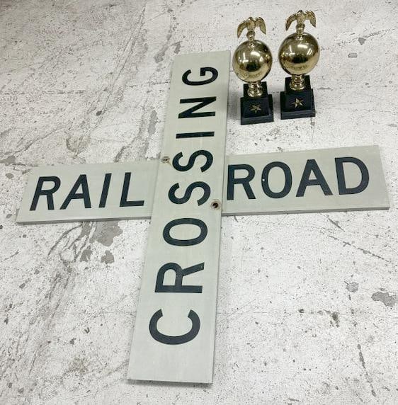Estate lot RAILROAD CROSSING sign & brass fireplace balls with Eagles: Estate lot RAILROAD CROSSING sign & brass fireplace balls with Eagles, the brass pair have iron bases, quite heavy, the Railroad Crossing signs (2 pieces ) measure 48" x 9", the pair of brass fireplac