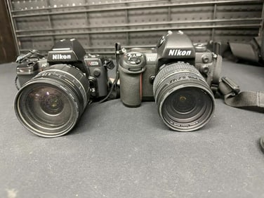 (2) Nikon Cameras in camera back pack with accessories, from fine local estate, selling it this way