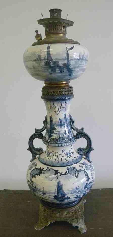 28" High Early Dutch Ceramic Oil Lamp Prob. DELFT: 28" High Early Dutch Ceramic Oil Lamp Probably Delft, fresh from Stone Ridge, New York estate, I see no damage, base could use a cleaning. scenic design on both sides. My guess is late 19th century...
