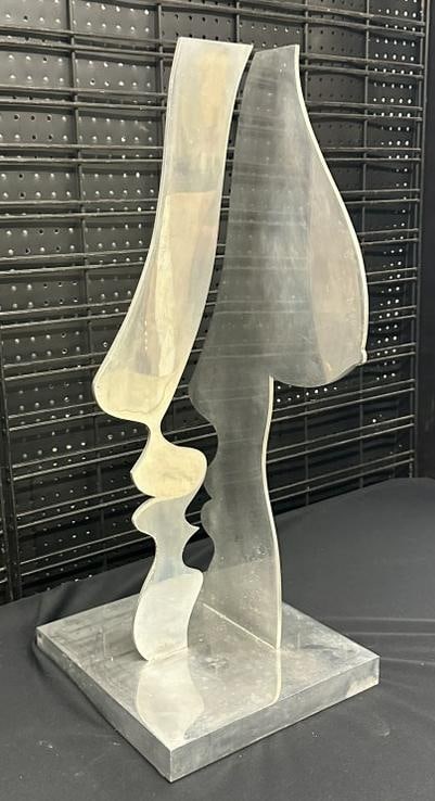 Abstract polished chrome sculture of breast, unsigned, measures 29" high and base is 12" x 12". From (1 of 3)