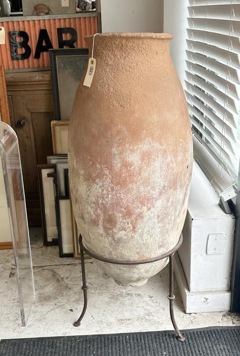 Large terra cotta vessel on iron base, nice overall condition, vessel measures 36" high, on base it (1 of 2)