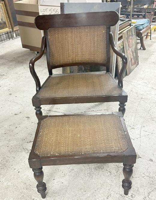 Interesting chair with caned back & seat, with ottoman, structurally sound, origin unknown. Made in: Interesting chair with caned back & seat, with ottoman, structurally sound, origin unknown. Made in Italy stamped on bottom. Measures 35" high x 31" wide x 23" deep.