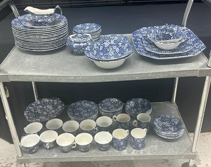 Estate lot ( BLUE CALICO pattern by ROYAL WESSEX/CROWNFORD ), in overall nice condition. From Hudson: Estate lot ( BLUE CALICO pattern by ROYAL WESSEX/CROWNFORD ), in overall nice condition. From Hudson Valley estate…just as we found it…..includes platters, serving pieces, (14) dinner plates…..