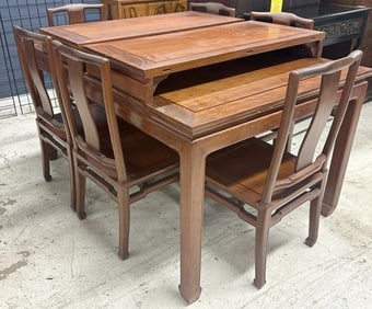 ASIAN hardwood dining table with (2) leaves and (6) chairs with Asian carved symbols on