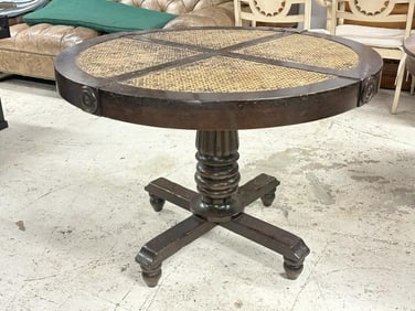 Decorative round table with cane top, nicely turned base, and structurally sound. Possibly had a