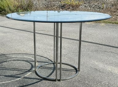 Nice Modern round plate glass table with plate glass top, used as an eating table, nice chrome form