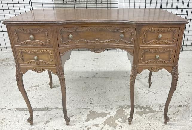 Circa 1940's mahogany carved ladies desk nice condition, from NYC estate, some small wear spots to: Circa 1940's mahogany carved ladies desk nice condition, from NYC estate, some small wear spots to finish, structurally sound, measures 42" wide x 23" deep x 31" high.