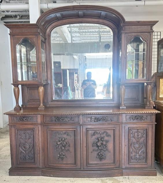 Monumental oak carved sideboard, with mirrored back, beveled glass doors and heavily carved drawers (1 of 2)