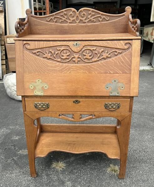 Circa 1910 oak carved dropfront desk with cubby holes inside, nice fancy original brass hardware. (1 of 4)