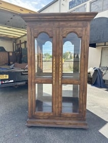 Nice decorative display cabinet, plate glass shelves, with morror back and nice brass hardware. From