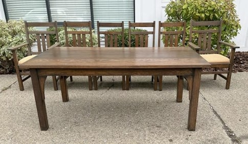 Contemporary Mission Oak dining room table and (6) Mission Oak chairs, including (2) armchairs. From