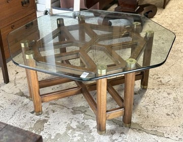 Circa 1970's or 80's plate glass hexagonal coffee table with wood base ( missing one brass cap off