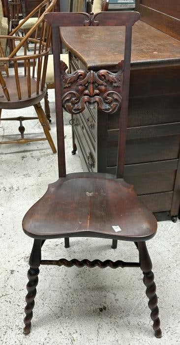 Circa 1910 twist leg side chair with Northwind God face on back, some wear to finish, measures: Circa 1910 twist leg side chair with Northwind God face on back, some wear to finish, measures 39.25" high.