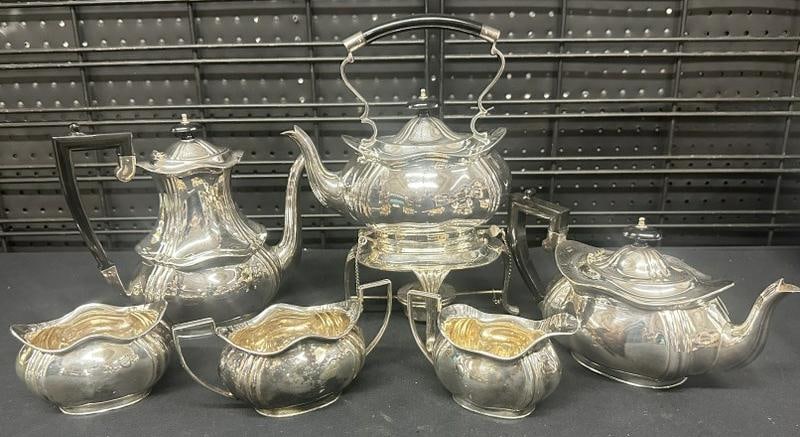 Buckingshire silverplate tea set, includes (3) pots with one on a stand, sugar, creamer & (1 of 3)