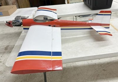 Large radio controlled airplane model with engine….measures approx. 45" long x 49.5" wing