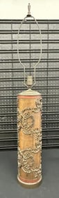 Decorative wood with metal design old wallpaper roller converted in to a table lamp. From Hudson