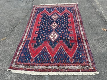Vibrant handmade wool oriental rug, thick pile, excellent condition, measures 95" x 64". From a