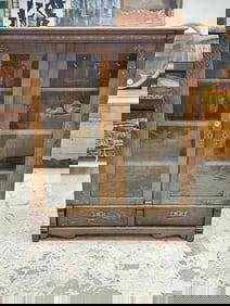 Circa 1910 quarter sewn oak (2) door bookcase with nice brass decorative trim on doors, with (2)