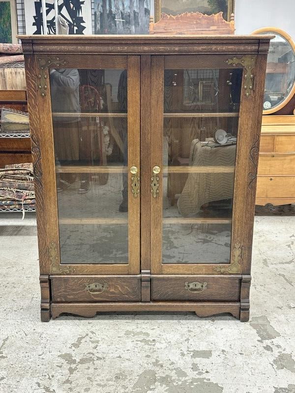 Circa 1910 quarter sewn oak (2) door bookcase with nice brass decorative trim on doors, with (2) (1 of 4)
