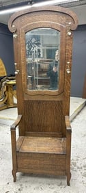 Quarter sewn oak circa 1900 hall tree with replaced hat hooks, has lift top seat, with later added