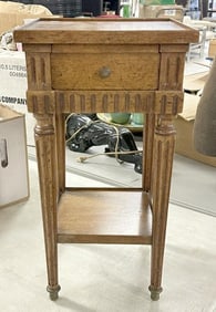 Diminutive one drawer stand, with tapered legs….nice condition, has brass feet, measures 19" high