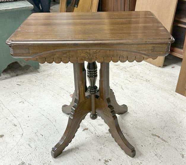 Refinished walnut Eastlake table, structurally sound, from nice local estate. Measures 30" x 22" x: Refinished walnut Eastlake table, structurally sound, from nice local estate. Measures 30" x 22" x 29" high.