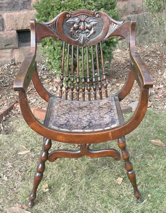 Carved mahogany circa 1910 spindle back armchair with carved face on back, from fine Kingston, N.Y.: Carved mahogany circa 1910 spindle back armchair with carved face on back, from fine Kingston, N.Y. Victorian….structurally sound, measures 24.5" wide x 22/5" deep x 36.5" high.
