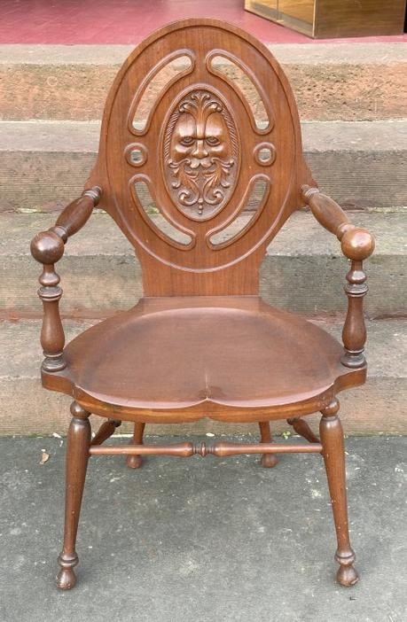 Unusual form carved mahogany armchair with Northwind God face on back, from Kingston, N.Y.: Unusual form carved mahogany armchair with Northwind God face on back, from Kingston, N.Y. home….nice overall condition. Measures 22.5" wide x 17" deep x 39.5" high.