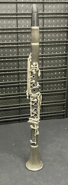 Older clarinet, no case, can't see a Makers name, some light stains on wood body, measures 26.5": Older clarinet, no case, can't see a Makers name, some light stains on wood body, measures 26.5" long.