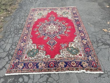 Handmade wool oriental rug, vibrant color, good pile, very good condition. Measures 118" x 81".
